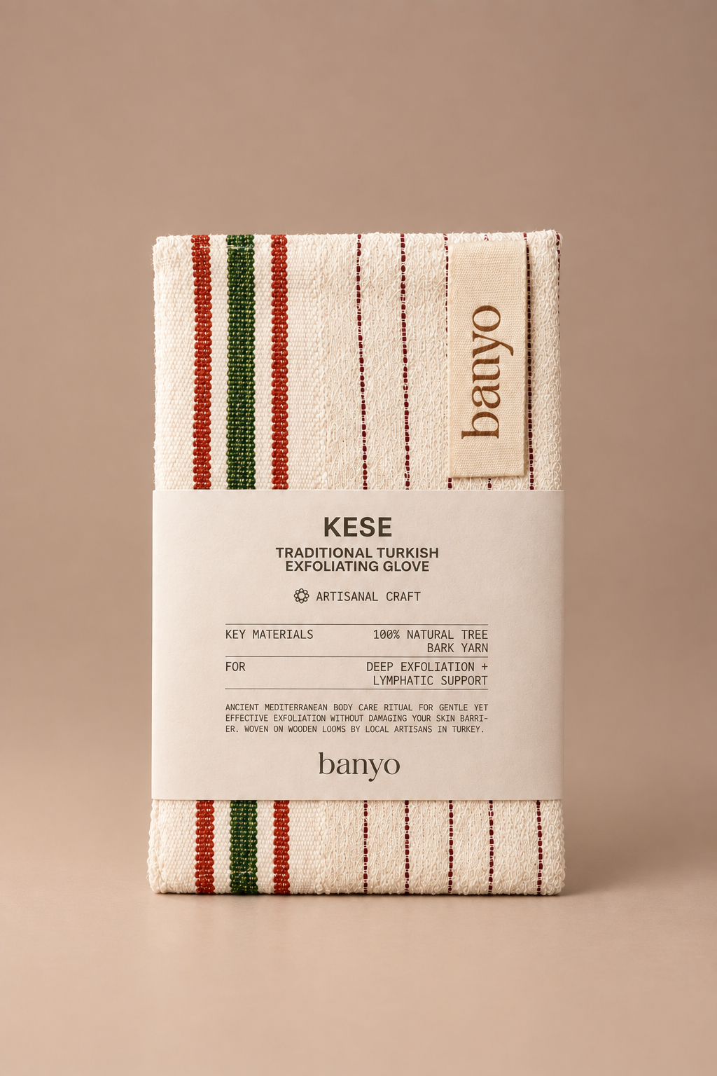 Banyo Kese traditional Turkish exfoliating glove made with natural tree bark yarn on a seamless mushroom studio background.